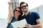 Young Tourist Couple Use Their Map And Pointing Where They Want Stock Photo