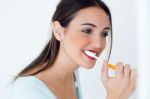 Pretty Young Woman Brushing Her Teeth Stock Photo