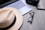 Closeup Of A Wooden Table With Laptop Stock Photo