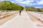 Cyclist On Countryside Road Near Alauca In Honduras Stock Photo