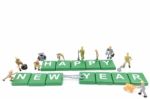 Miniature Worker Team Building Word Happy New Year On White Background Stock Photo