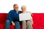 Elderly Couple With Laptop Stock Photo