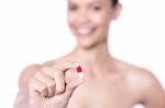 Portrait Of Beautiful Woman, Holding  Pill Stock Photo