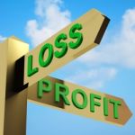 Profit Or Loss Directions On A Signpost Stock Photo