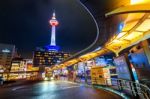 Kyoto Tower At Night In Kyoto, Japan Stock Photo