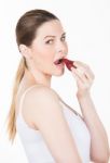 Woman Eating Strawberry Stock Photo