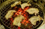 Grilling Pork On Grill Stock Photo