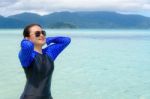 Asian Teen Girl Is Relax In The Sea During Travel To Ko Lipe, Thailand Stock Photo