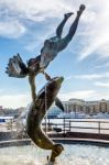 David Wayne Sculpture "girl With The Dolphin" Next To Tower Brid Stock Photo