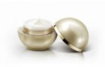 Golden Sphere Cosmetic Jar On White Background Stock Photo