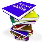 Travel Guide Book Stack Shows Information About Travels Stock Photo