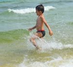 Boy On The Beach Stock Photo