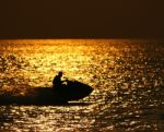 Jet Ski On An Ocean At Sunset Stock Photo