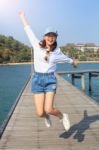 Portrait Of Young Beautiful Woman Jumping With Happy Emotion On Stock Photo