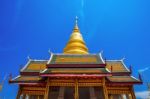 Wat Phrathat Hariphunchai Golden Pagoda In Lamphun,thailand Stock Photo