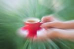 Woman Serve Red Cup Of Coffee Stock Photo