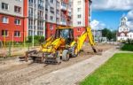 Construction Of A New Road. Excavator Prepares The Surface Stock Photo