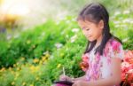 Asian Girl Write An Note Pad Stock Photo