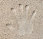 Hand Print In Sand Stock Photo