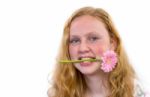 Dutch Teenage Girl With Pink Flower In Mouth Stock Photo