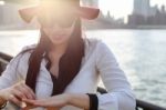 A Woman With The City In The Background Stock Photo