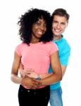 Smiling Young Couple Embracing Stock Photo