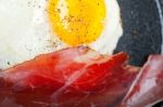 Egg Sunny Side Up With Italian Speck Ham Stock Photo