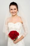 Smiling Bride With A Rose Bouquet Stock Photo