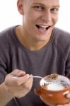 Smiling Man Eating Cornflakes Stock Photo