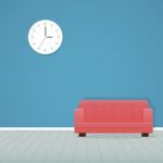 Clock On Blue Wall And Red Sofa Minimal Stock Photo