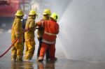 Fireman. Firefighters Fighting Fire During Training Stock Photo