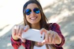 Portrait Of Beautiful Girl Taking A Selfie With Mobile Phone In Stock Photo