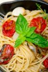 Spaghetti Pasta With Baked Cherry Tomatoes And Basil Stock Photo