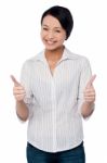 Happy Beautiful Girl Giving Two Thumbs Up Stock Photo