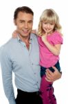 Cute Little Daughter Being Carried By Her Father Stock Photo