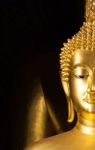 Golden Buddhist Statue Face Stock Photo