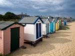 A Row Of Brightly Coloured Beach Huts In Southwold Stock Photo