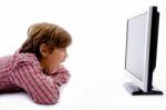 Side Pose Of Boy Watching Lcd Screen Stock Photo