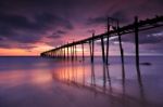 Wooden Bridge Into The Sea Stock Photo