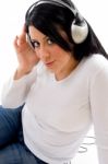 Side Pose Of Model With Headphone On White Background Stock Photo