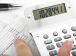 Bookkeeping With Calculator Stock Photo