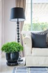 Black Pillows On Classical Style Sofa With Black Lamp Stock Photo