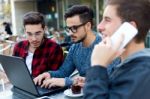 Outdoor Portrait Of Young Entrepreneurs Working At Coffee Bar Stock Photo