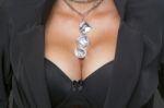 Woman With Big Breasts And Jewelry On Neck Stock Photo