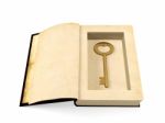 Opened Ancient Paper Book With Retro Golden Key Hidden Inside Stock Photo