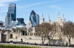 View Of The Tower Of London And Modern City Buildings In The Bac Stock Photo