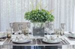 Plants In Glass Vase On Dinning Table Stock Photo