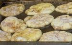 Fresh Apple Cinnamon Fritters In The Fryer Stock Photo