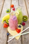 Fresh Blended Fruit Smoothies In Vintage Milk Bottles Stock Photo