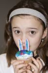 Child With Easter Bunny Cupcake Stock Photo